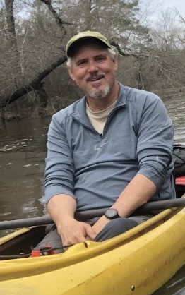 Celebrating TLC Staff: Bo and the TLC Brand Bo in Canoe 1