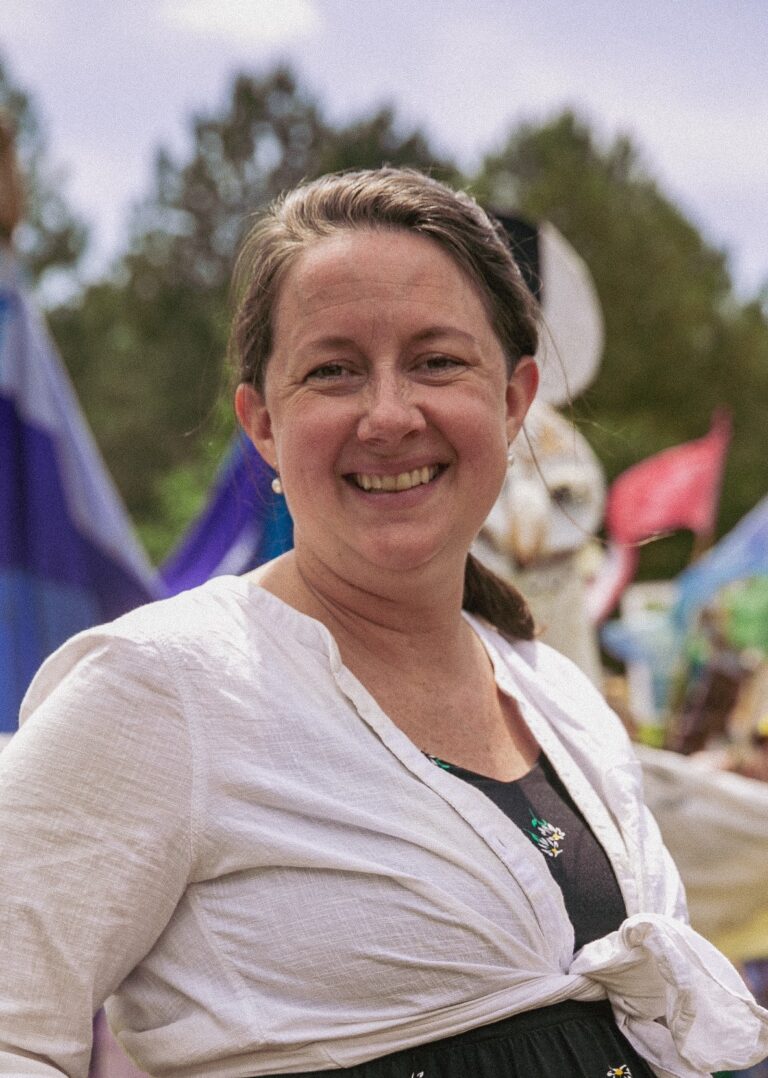 Margaret Sands smiling at an outdoor festival.