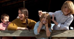Gates, Alicia, Finn, and Jackson having fun on the farm 